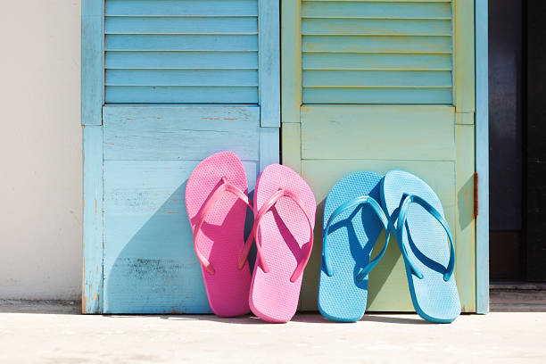 istock Summer Tropical Vacation—Sandals Leaning on Shutters Horizontal 486022985
