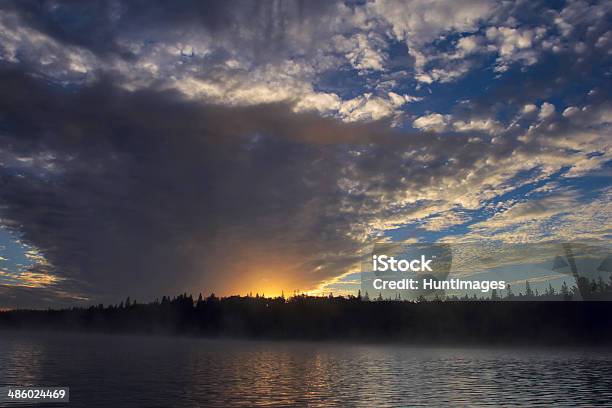 Morning Sun Shining Out From A Huge Swathe Of Clouds Stock Photo - Download Image Now