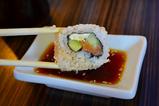 Delicious sushi with cucumber, salmon and philadelphia