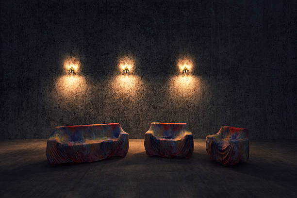 Empty castle room with covered furniture.