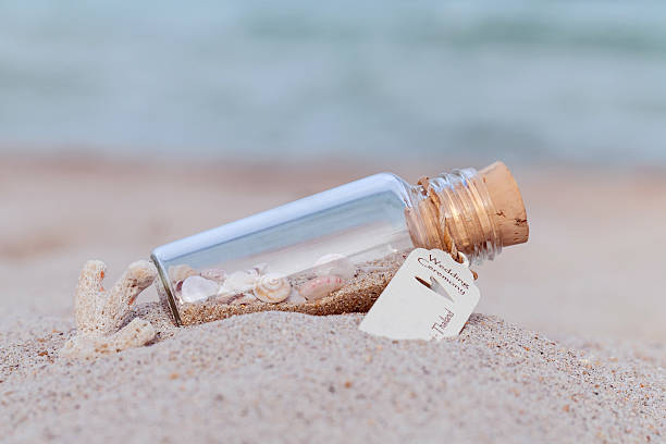istock Sand and sea shell in bottle  . 486025560