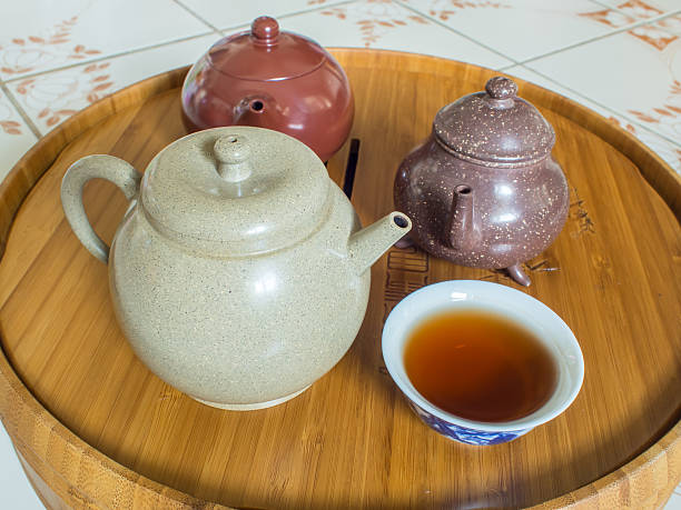 istock Chinese Teapot on teapot stand, made of bamboo. 486028376