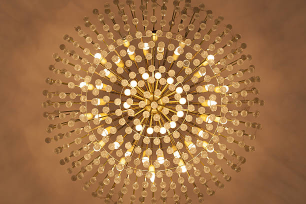 istock Lamp chandelier hanging from the ceiling in warm tone. 486032530