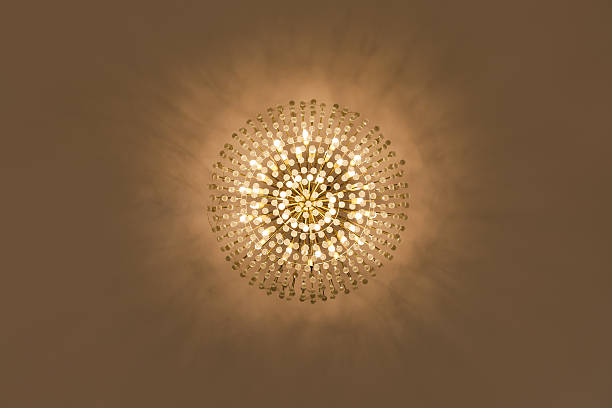 istock Lamp chandelier hanging from the ceiling in warm tone. 486032532