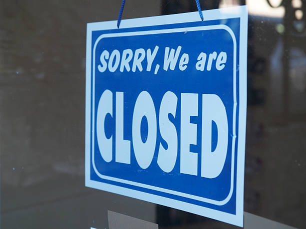 istock Closed Sign in a Shop Window 486032844