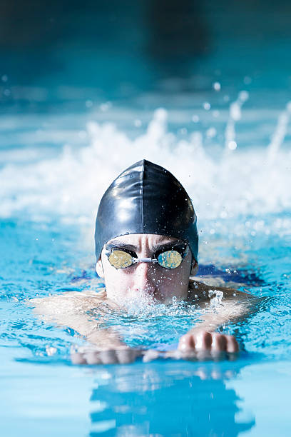 istock male swimmer swimming with a swim board 486033440