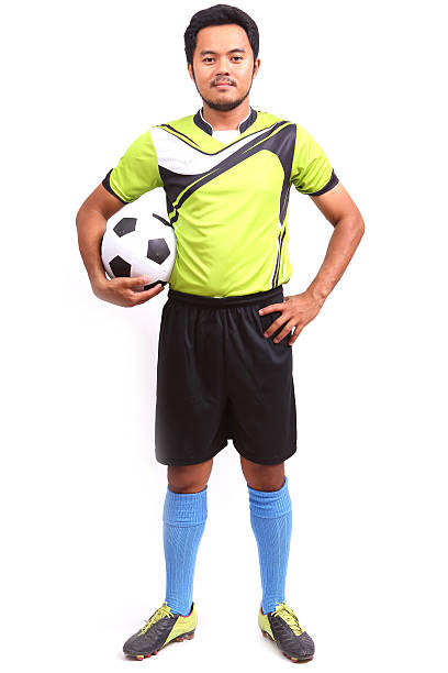 istock Young soccer football player on white 486037399