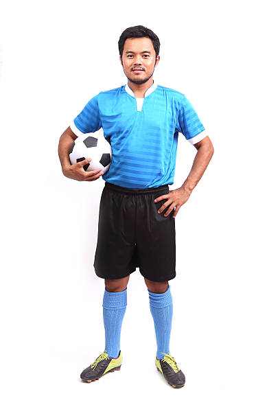 istock Young soccer football player on white 486037407