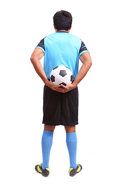 istock Young soccer football player on white 486037411