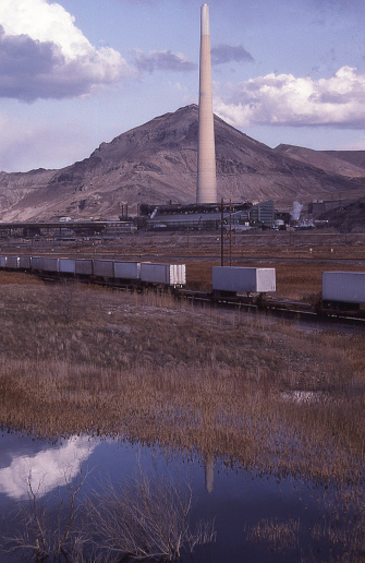 Wetlands and Reflection of Smokestacks of Magna Utah Copper Smelter and Railroad