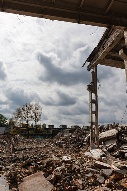 istock Destroyed factory building and rubble - industrial background 486038614