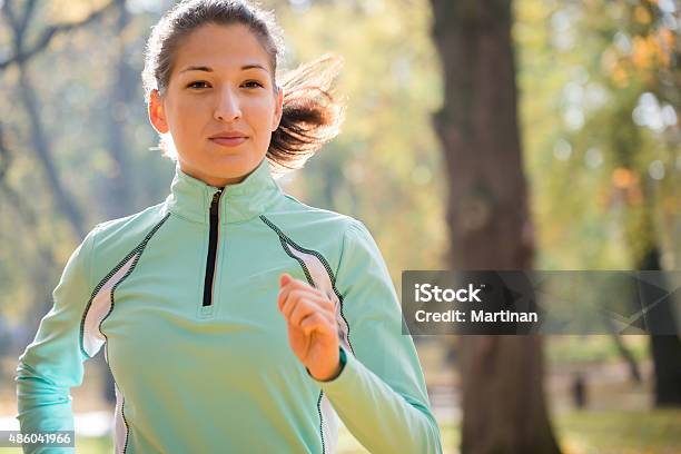Woman Jogging In Nature Stock Photo - Download Image Now - 2015, Active Lifestyle, Activity