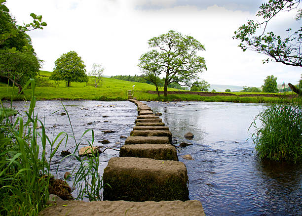 Stepping Stones Stepping Stones across the River Hodder in the Forest of Bowland near Clitheroe Lancashire. lancashire photos stock pictures, royalty-free photos & images