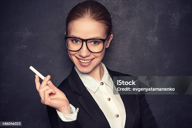 Портрет учителя поправляющего очки на носу фотография Stock Adobe Stock
