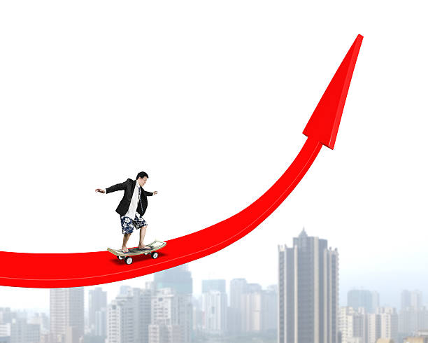 istock Man skating with money skateboard on red arrow 486046225