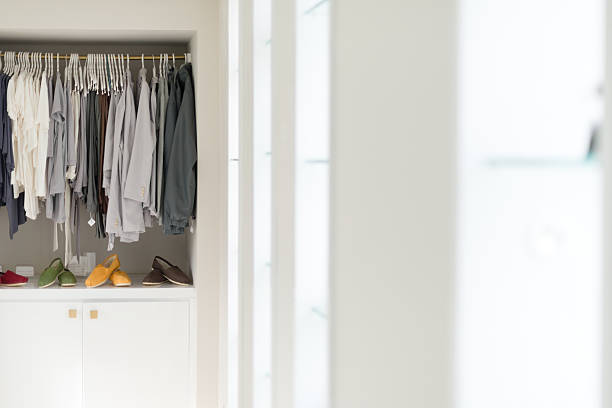 istock Casual clothes on hangers and shoes at shop. 486046607