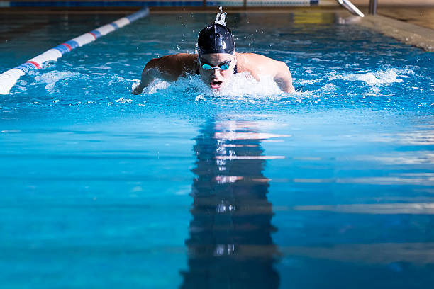 istock young woman swimming butterfly stroke 486047100