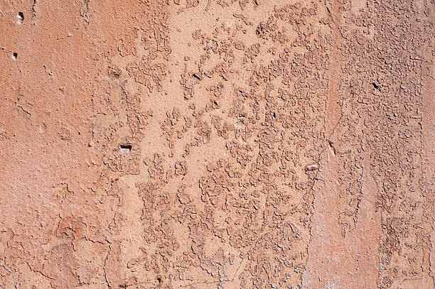 istock Texture of old wall covered with brown stucco 486047498