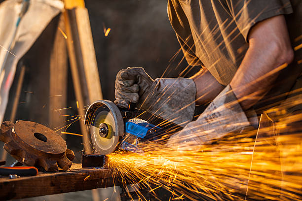 istock Close-up of worker cutting metal with grinder 486050984