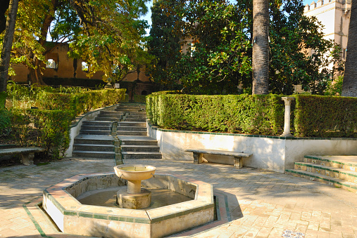 Source in the gardens of the Alcazar in Seville, Andalusia, Spain