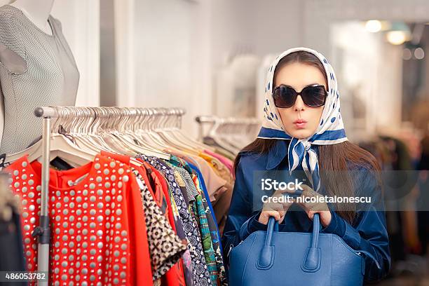 Curious Girl In Blue Trench Coat And Sunglasses Shopping Stock Photo - Download Image Now