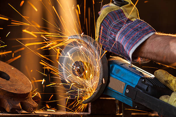 istock Close-up of worker cutting metal with grinder 486054224