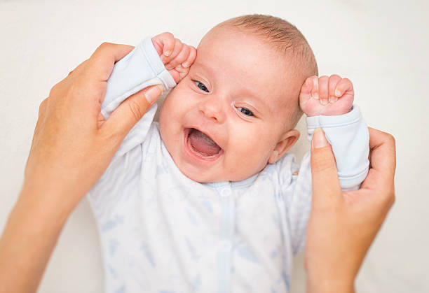 istock Mother playing with cute little baby. 486054940