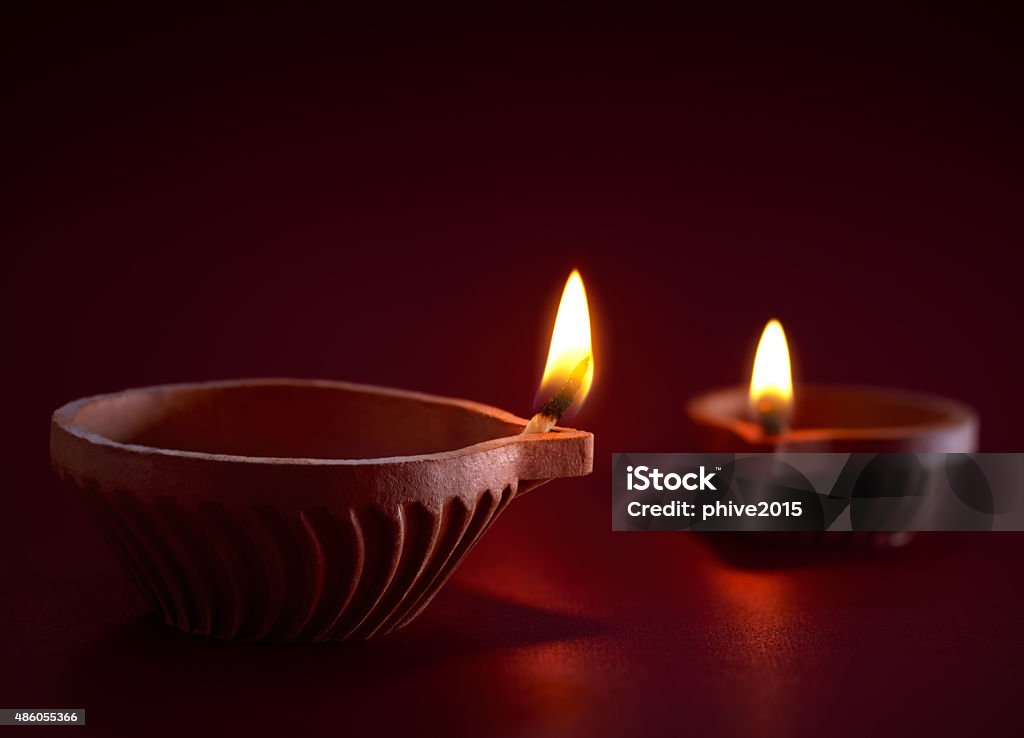 Diwali oil lamp Traditional clay diya lamps lit during diwali celebration Oil Lamp Stock Photo