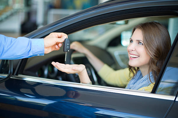istock Woman bying car. 486055685