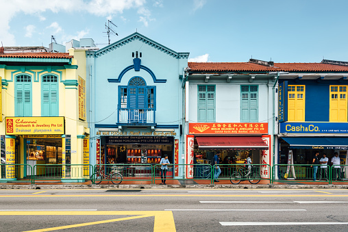 Singapore, Singapore - December 12, 2014: Colorful shophouses along Little India in Singapore. In the early 1800s, Little India began as a colony set up by Indians who came to Singapore as prisoners of the British Raj.