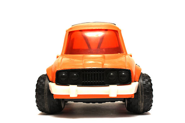 istock Toy orange car on white background 486059128