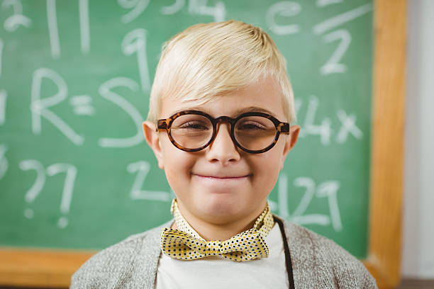 istock Smiling pupil dressed up as teacher in a classroom 486059470