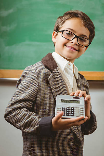 istock Pupil dressed up as teacher showing calculator 486059766