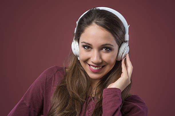 istock Smiling woman with headphones 486060148