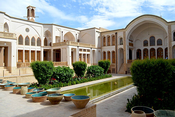 Traditional house in Kashan, Iran Manouchehri House (Khan-e Manouchehri), is one of the most outstanding old mansions in Kashan. Hundred years ago it belonged to carpet merchant, but is a boutique hotel with a restaurant, now. persian pottery stock pictures, royalty-free photos & images