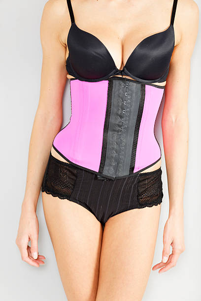 istock Woman in waist training corset 486063514