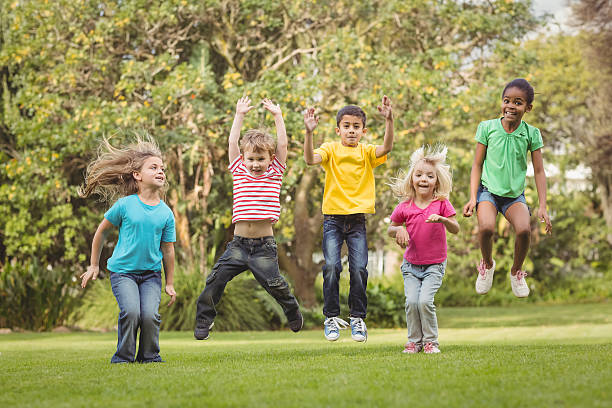 istock Happy classmates jumping in the air 486066600