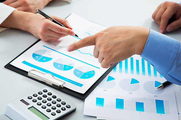 istock Image of man's hand pointing at business document 486067080