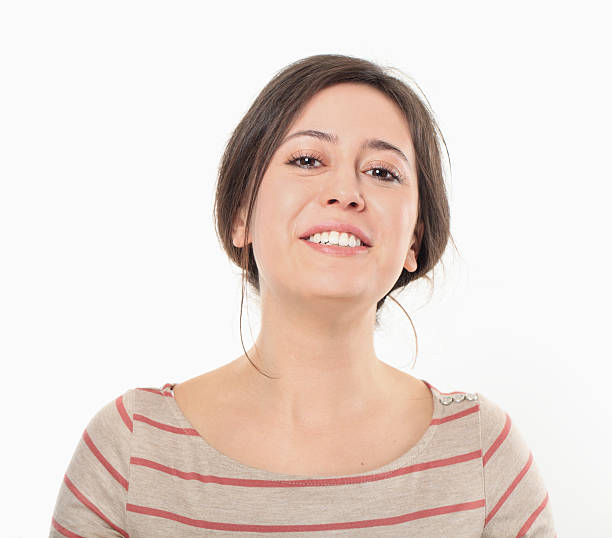 istock Happy Young Woman Smiling Portrait. 486070969