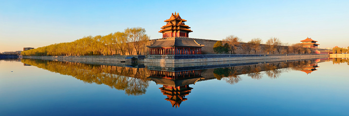 Imperial Palace over lake in the morning in Beijing.