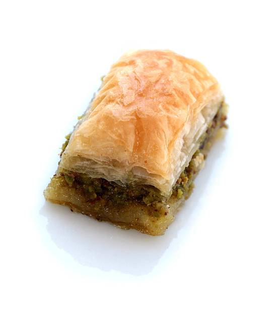 istock Turkish baklava with pistachio on white background 486072757