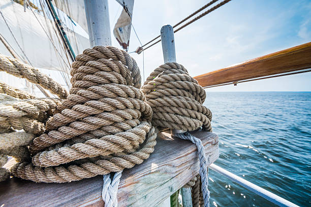 Wooden pulley and ropes on an old yacht. stock photo