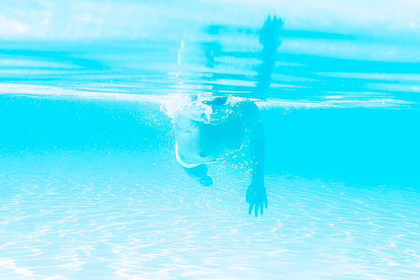 istock young man swimming the front crawl style in a pool 486073190