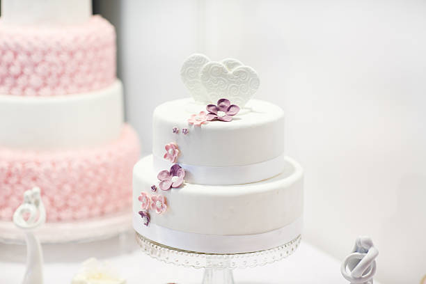 istock Delicious wedding cake in white , creme and pink 486073259