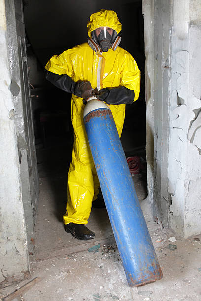 istock technician in uniform, dealing with steel cylinder wh gas 486073429