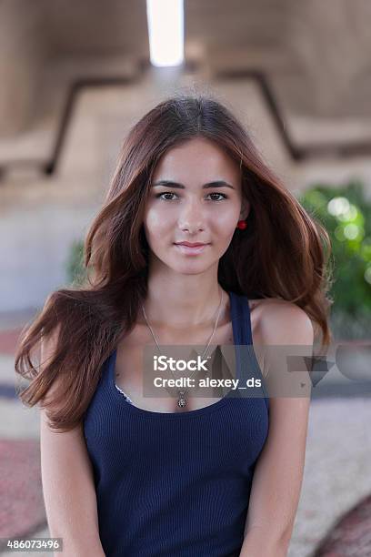 Smiling Young Woman In Dark Blue Tank Top Outdoors Portrait Stock Photo - Download Image Now