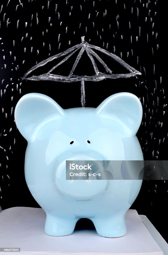 Saving for a Rainy Day Piggybank and drawing Piggy Bank Stock Photo