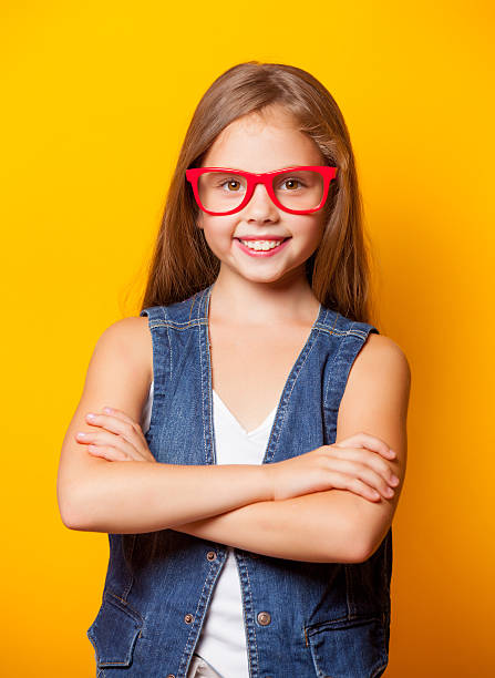istock Beautiful young girl with red glasses 486073678