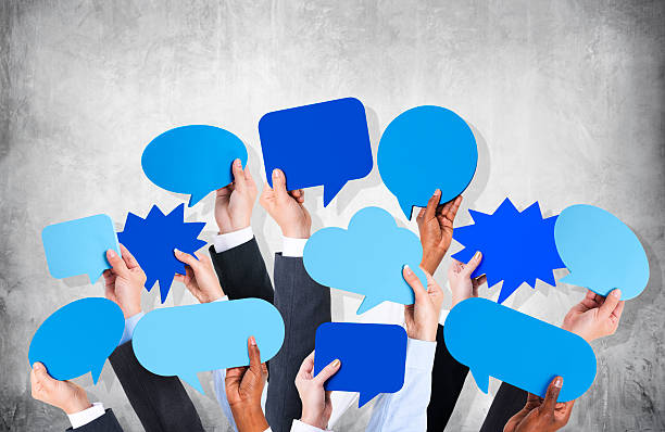 istock Business Arms Raised with Speech Bubble by Concrete Wall 486073791