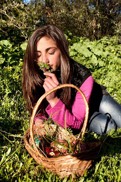 istock Young woman with basket picking flowers 486074853